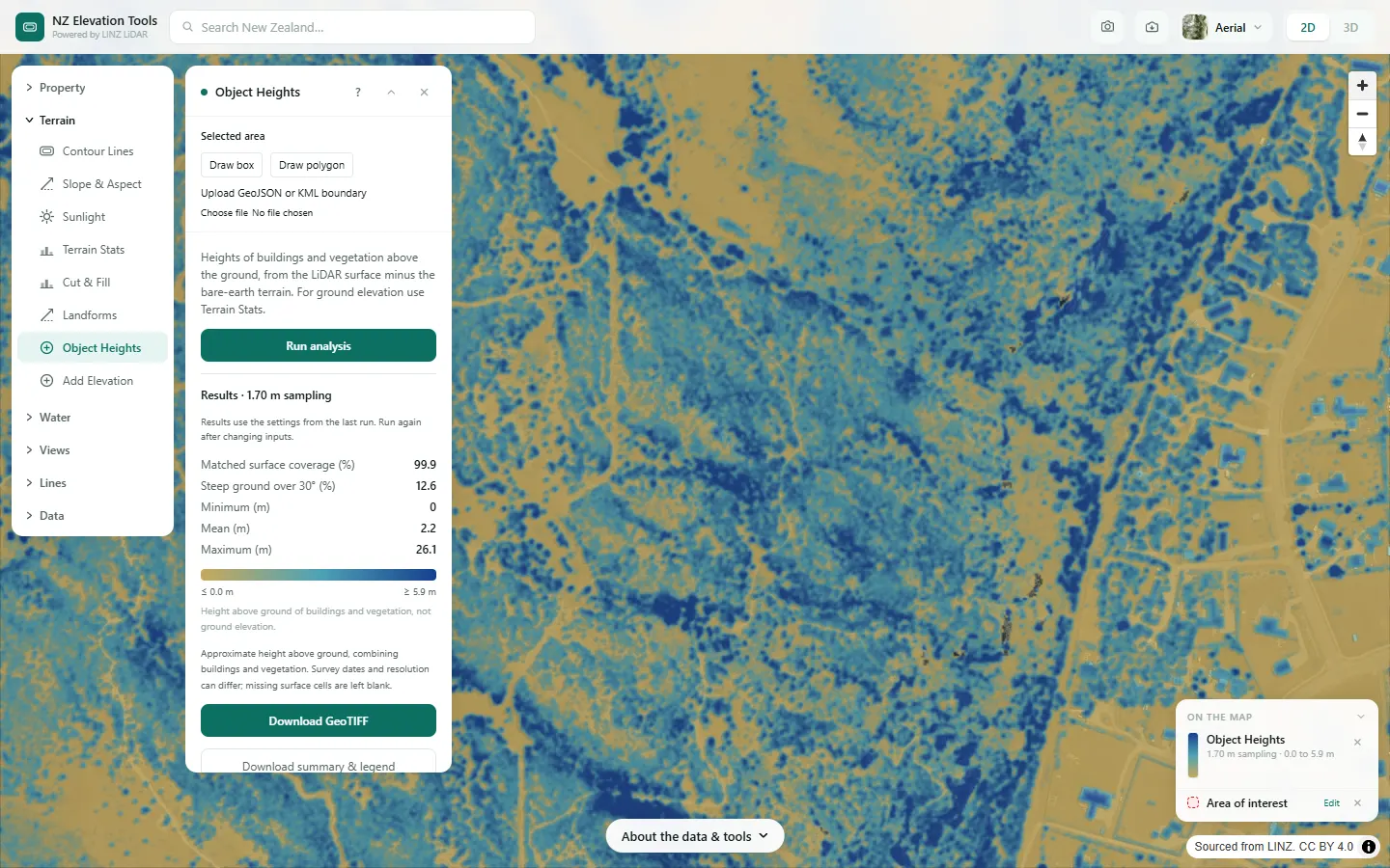 Close view of individual houses and trees picked out in blue